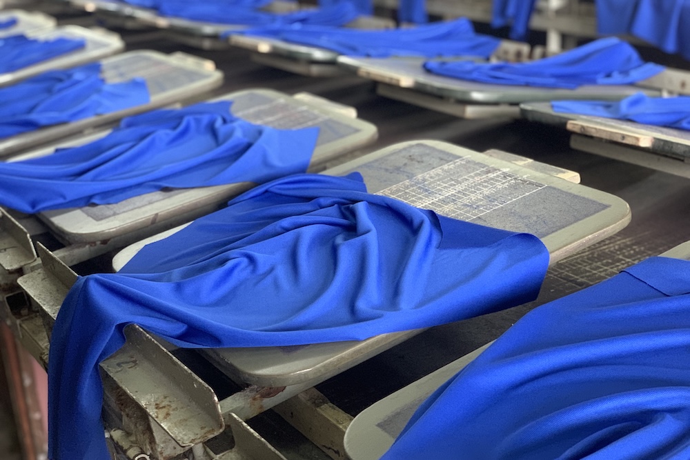 Dyed blue fabric on printing tables