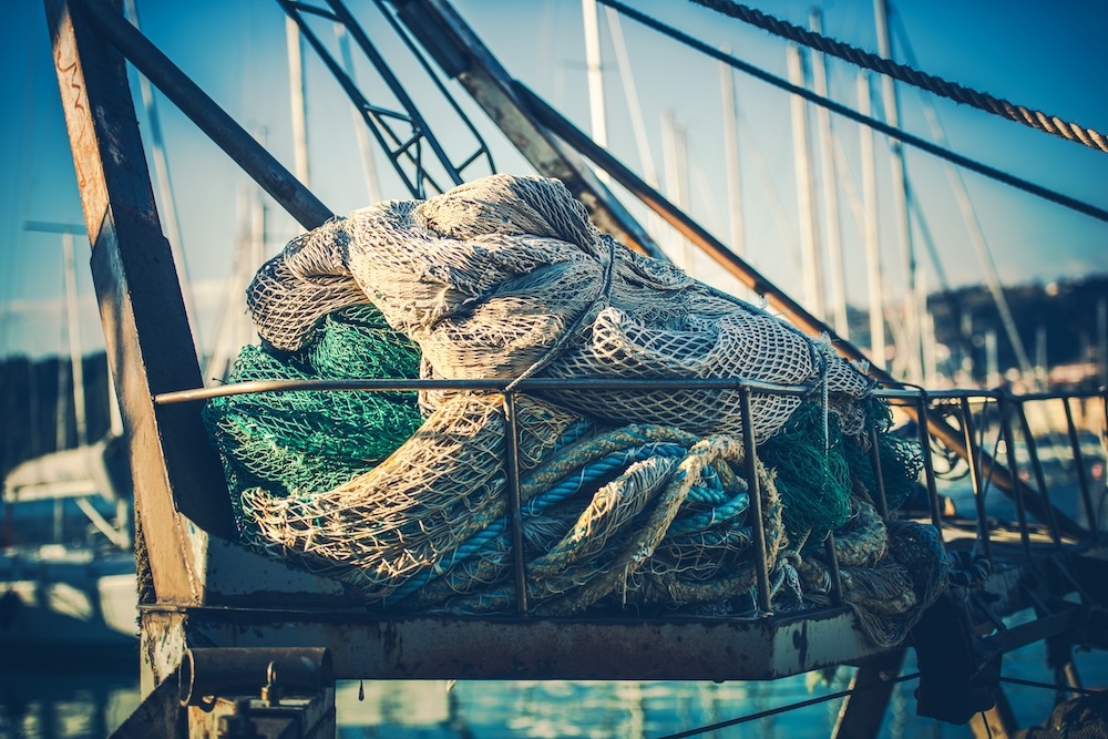 Fisherman fishing nets drying on boat
