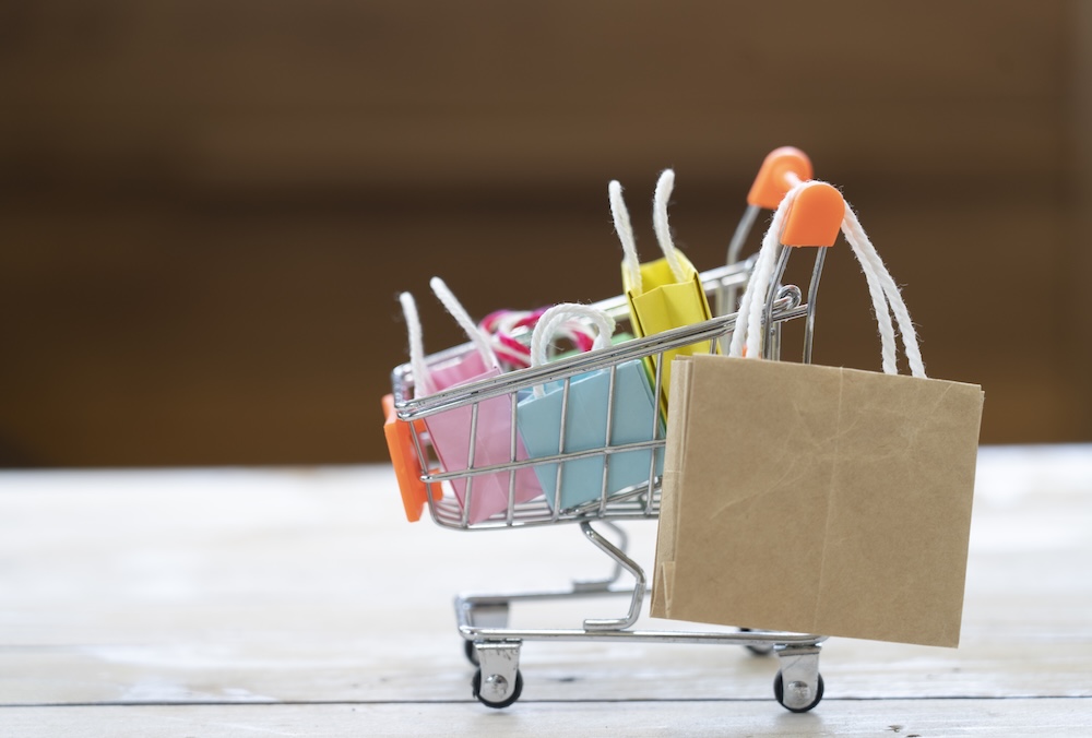 Miniture cart with multi-color shopping bags inside