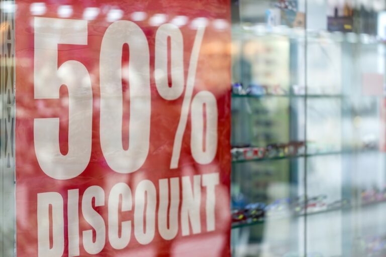 Sign that says 50% discount in a window