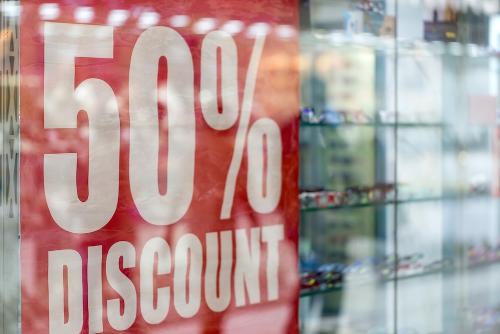 Sign that says 50% discount in a window