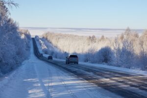 Cars driving in snowy weather on the highway