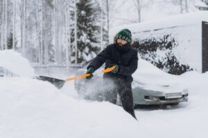 Man shoveling snow out of his driveway