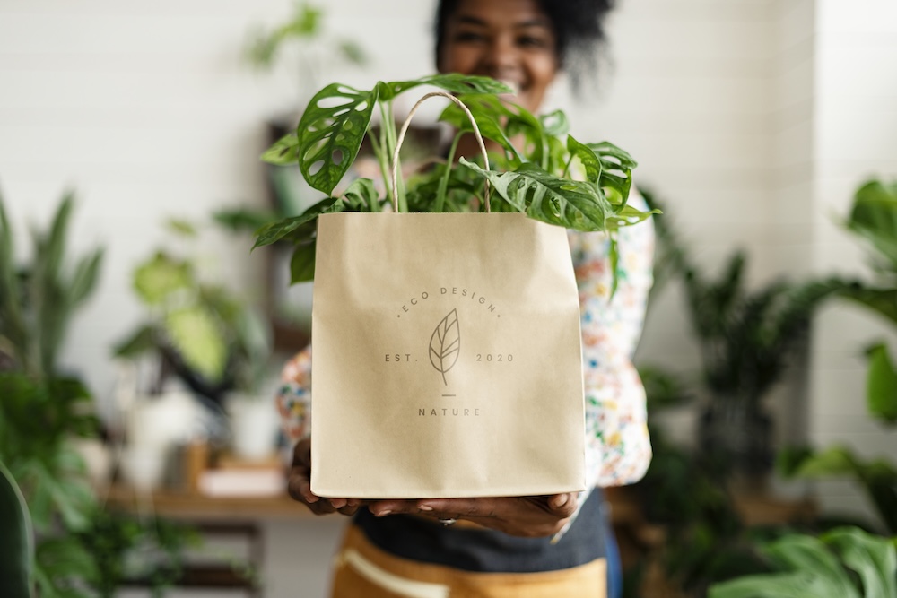 Woman holding a paper eco-friendly bag