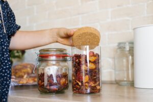Woman using reusable glass jars with a lid