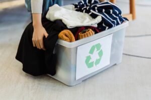 woman sorting clothes for the recycle center