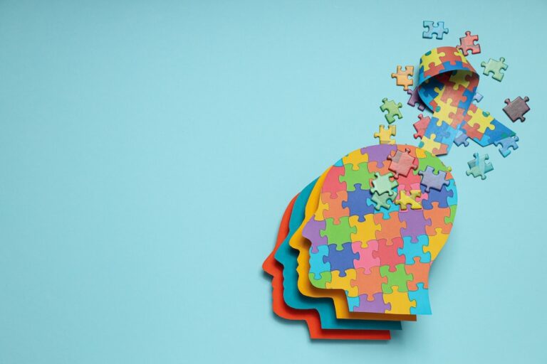 Colorful puzzle pieces in the shape of a brain