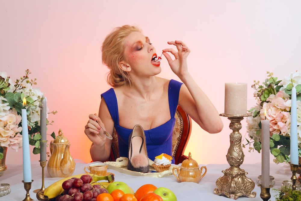 Young woman eating a very strange meal