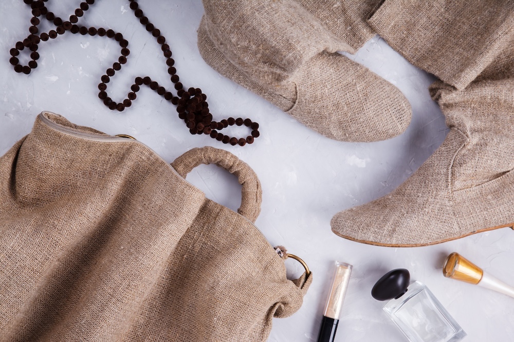 Slow fashion clothing spread out on a table