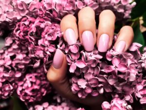 Pink nails matching spring flowers