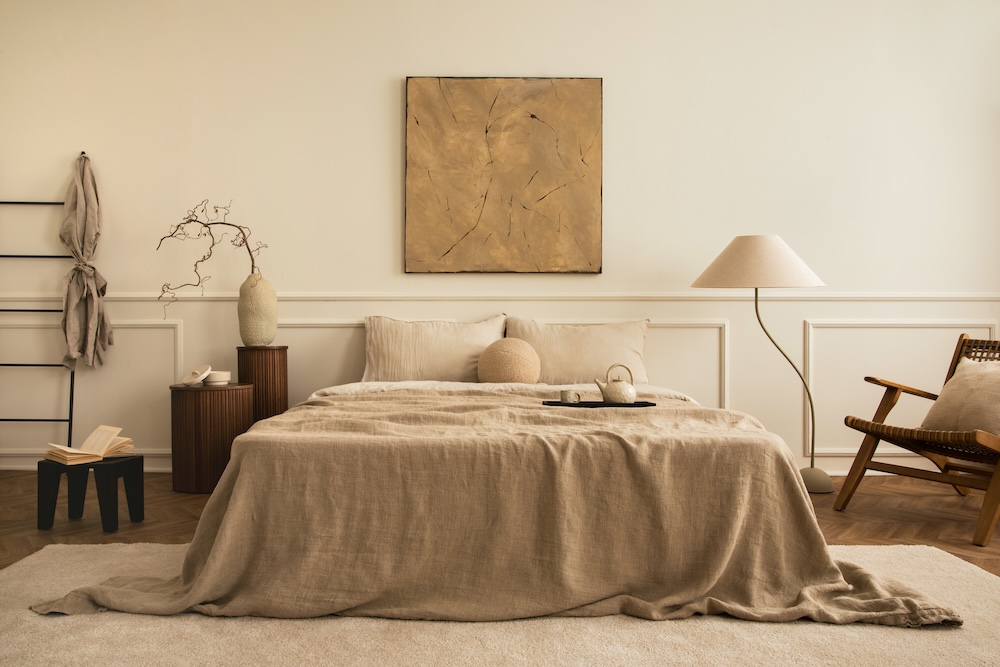 Stylish beige bedding with neutral decorations