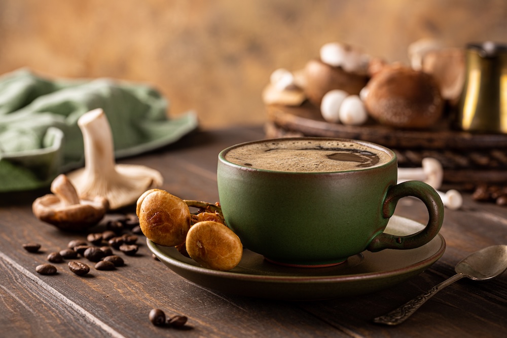 Mushrooms around a cup of coffee