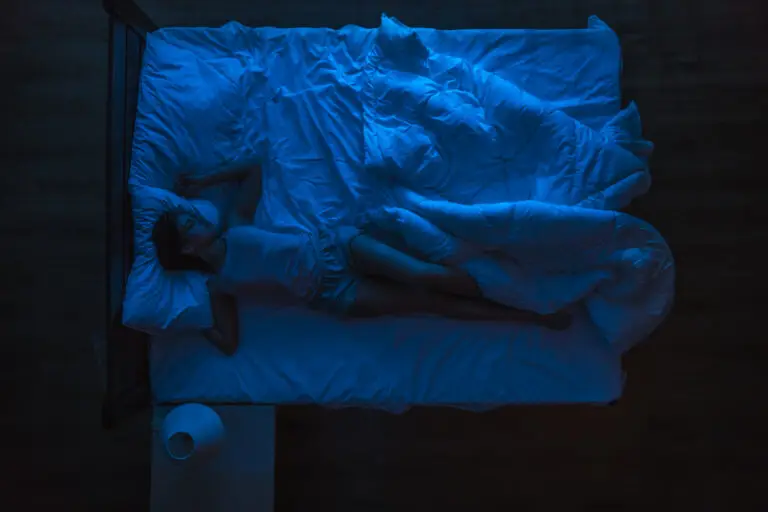 woman sleeping without covers