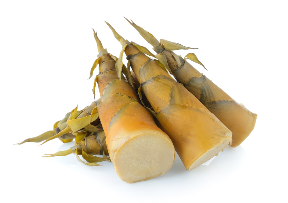 bamboo shoots cut into pieces on a white background