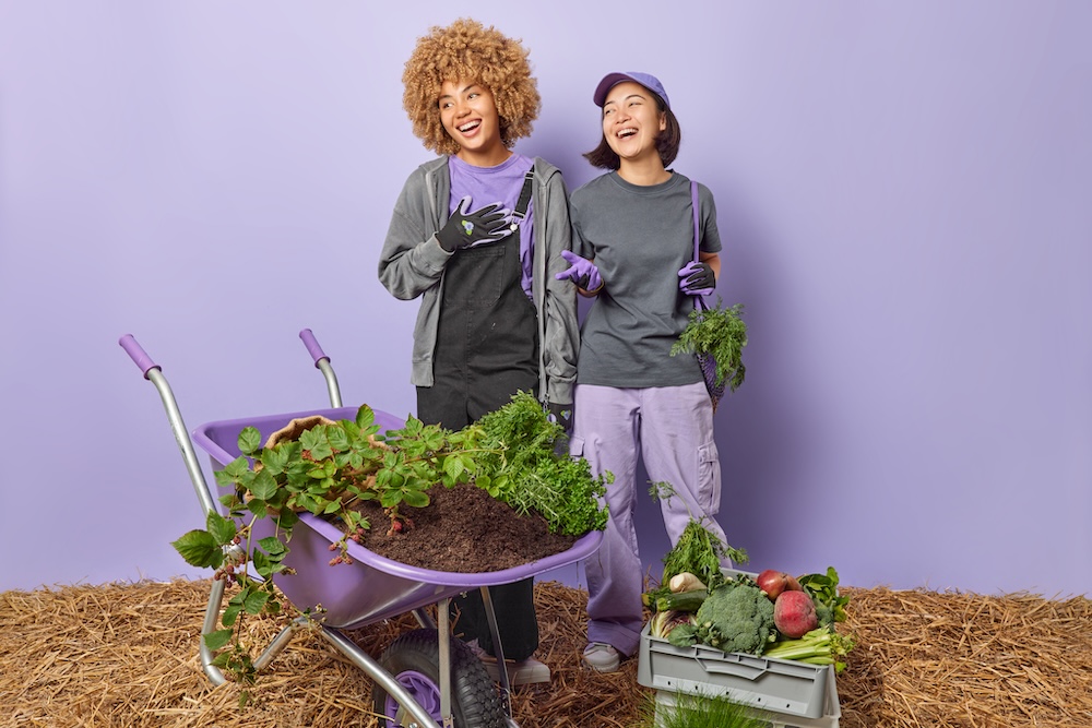 two women gardening for a plant-based lifestyle