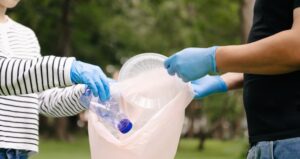 two people collecting recyclables
