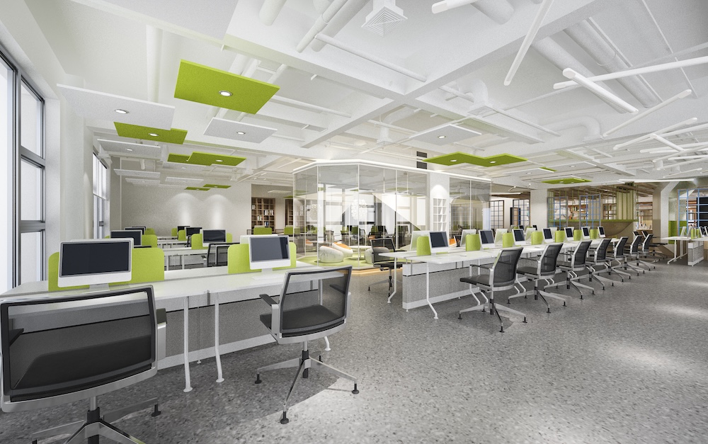 office with rows of desks and chairs with green dividers