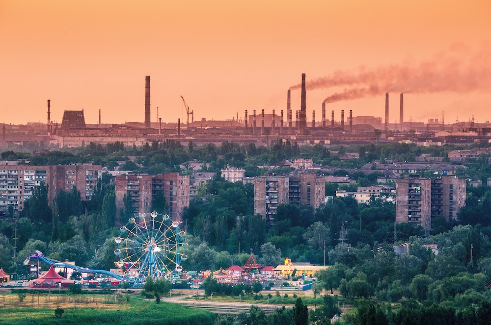 amusement park with a air pollution in the background