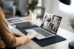 woman doing a virtual meeting from home