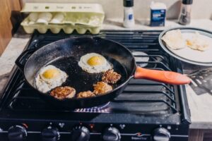 breakfast made in a pan on a stove top