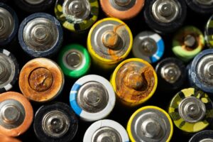 close up of old rusted and used batteries