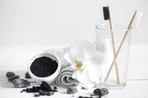 natural charcoal teeth cleaning solution on a table