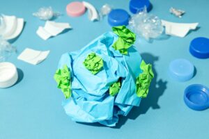 paper earth with pollution on all sides