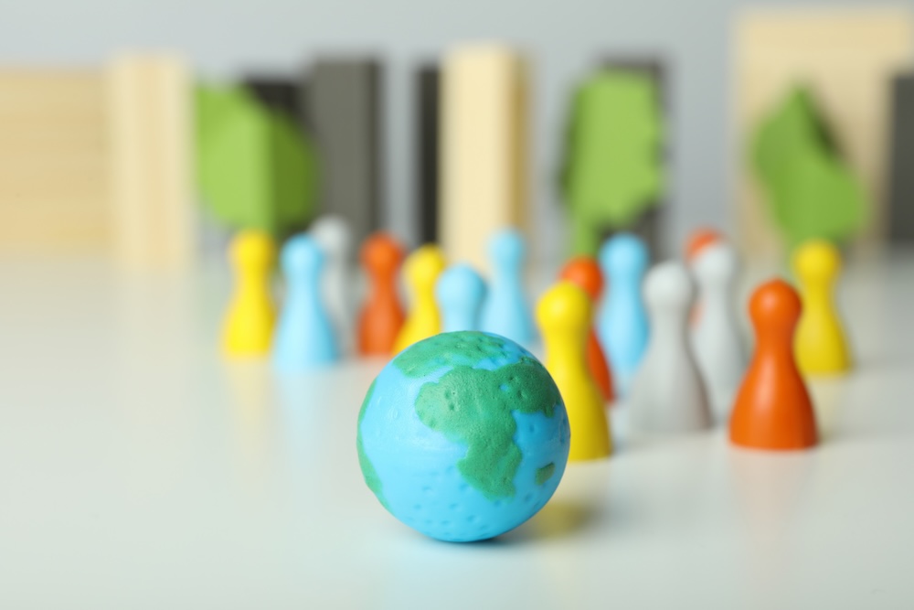 earth on a table with wooden people