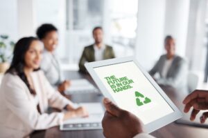 marketing team with tablet that says recycle on it