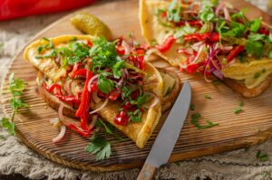 two vegetable omelettes on a cutting board