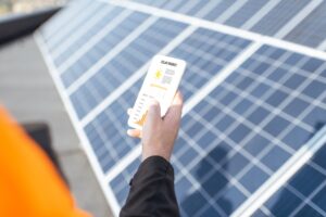 image of a person looking at the solar consumption of solar panels