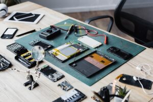 devices on a table being repaired and taken apart