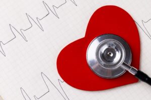 heart with a stethoscope reading ekg
