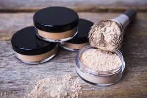 mineral powders with a brush with dusted mica on the table