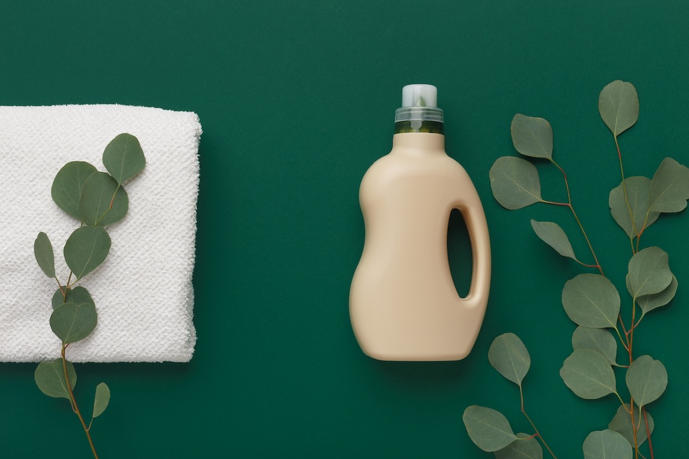 plastic bottle with green leaves decorated around it