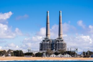 power plant against a blue sky