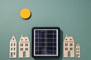small solar panel in between wooden houses