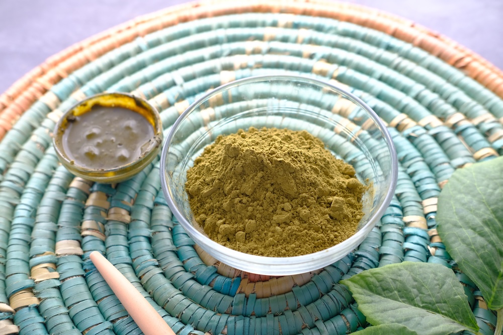 henna powder in a bowl on the table
