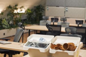 two unmarked containers for recycling in an office