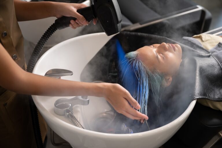 person having hair treatment with parabens evaporating into air