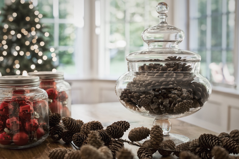 Large glass jars with holiday decorations inside