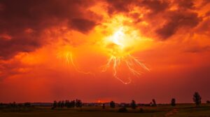 orange clouds with lightning strikes