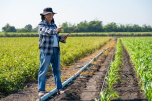 woman planning her irrigation for her crops