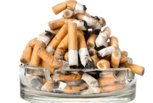 Disgusting pile of smoked cigarette butts