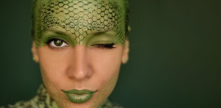woman with face painted green and green lipstick