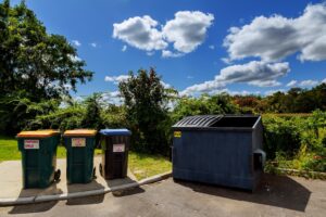 dumpsters and recycling bins outside