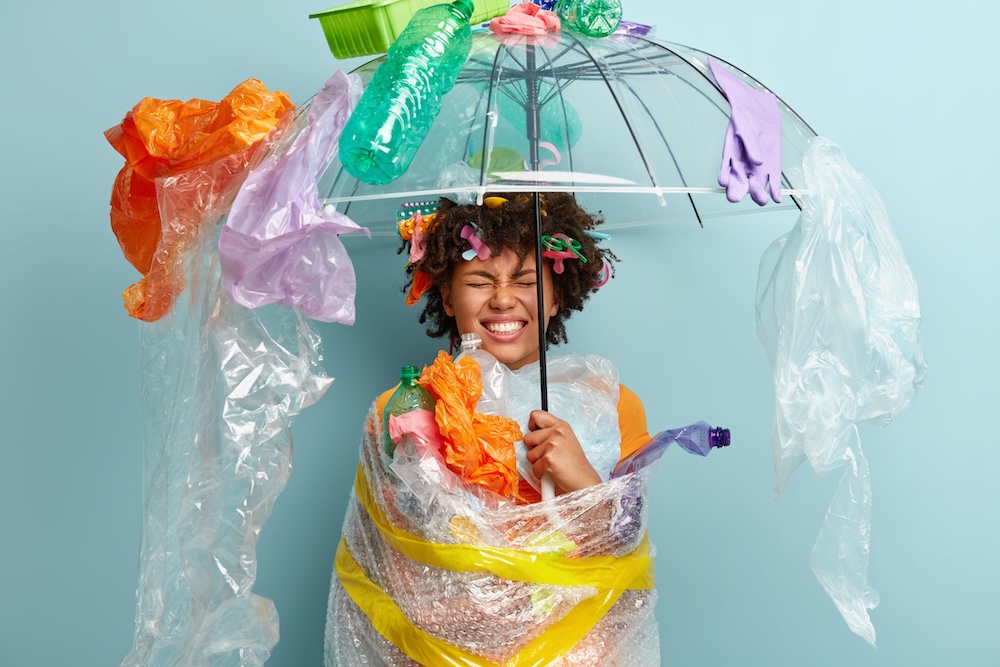 woman wrapped in plastic covered in plastic