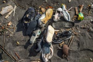 environmental shoe pollution with rubber shoes in dirt