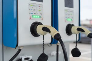 Ev charging station with two plugs