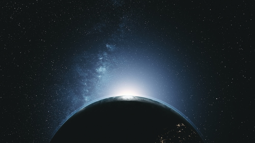 earth orbit with sunlight glowing above